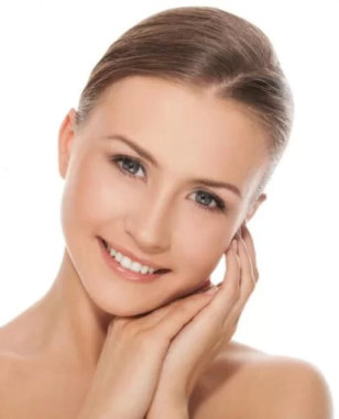 A woman with clear skin and a bright smile