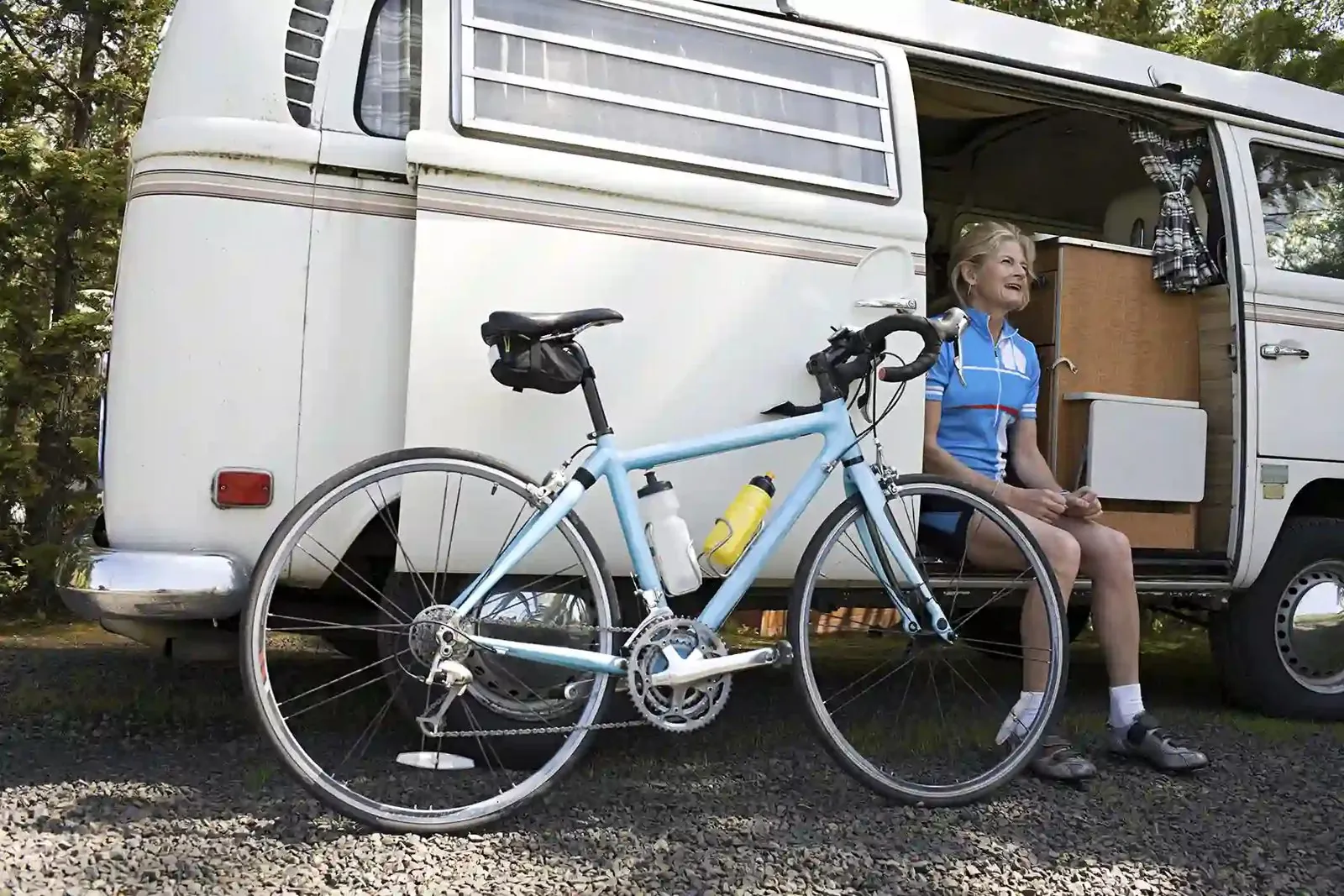 Bicycle parked next to a camper van